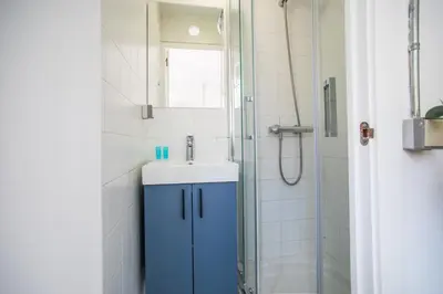 a bathroom with a sink and a shower at BBarcelona Sants Flat in Barcelona