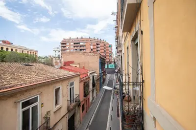 a view of an alley between two buildings at BBarcelona Sants Flat in Barcelona