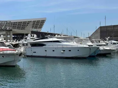 a group of boats are docked in the water at YACHT 20Metros in Barcelona