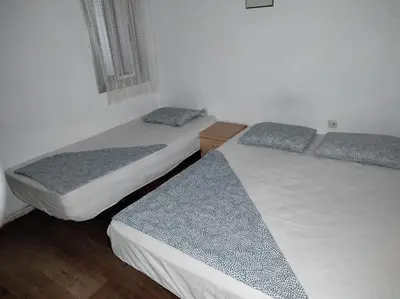 three beds in a room with twothirdsessionssenalsenalsenalsenalsenalsenalsenal at Sant Adrià in Sant Adria de Besos