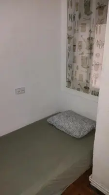 a room with a bed in the corner of a room at Sant Adrià in Sant Adria de Besos