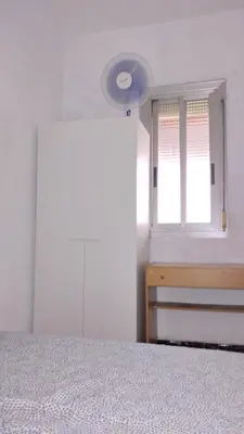 a bedroom with a bed and a window at Sant Adrià in Sant Adria de Besos