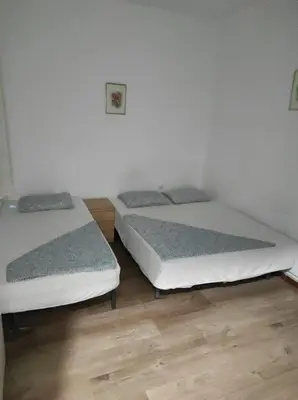 a room with three beds in a room at Sant Adrià in Sant Adria de Besos