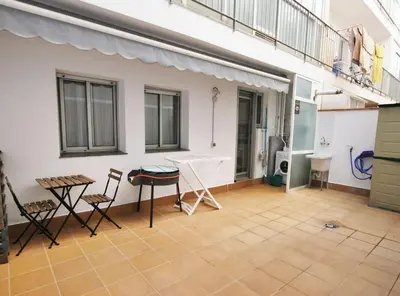a balcony with a table and chairs in a room at Gaudi Contemporani in Mataró