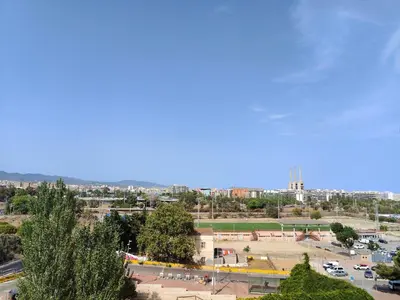 a view of a city with a parking lot at Family apartment Besos in Sant Adria de Besos