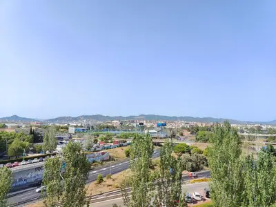an aerial view of a city with a highway at Family apartment Besos in Sant Adria de Besos
