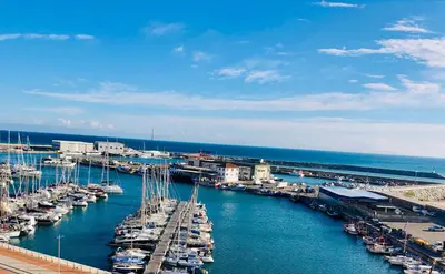 a group of boats docked in a harbor at Apartamento playa in Arenys de Mar