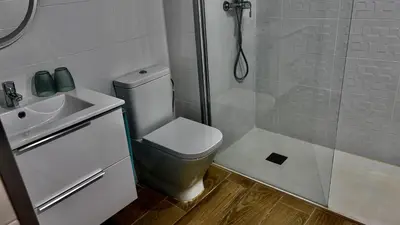 a bathroom with a shower and a toilet and a sink at Apartamento playa in Arenys de Mar