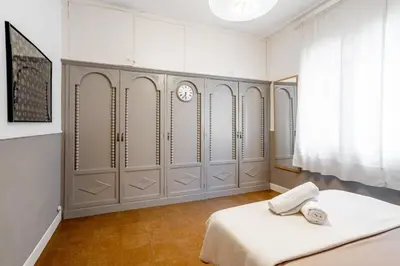 a hallway with a door leading to a living room at The Collection Barcelona - Sants Estacio - Modern and comfy 4BD for 8 guests in Barcelona