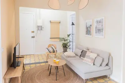 a living room with a couch and a table at Aticco Living Gràcia - Apartments Rooftop in Barcelona