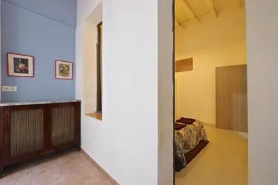 a hallway with a bed in a room at Parallel-Patio in Barcelona