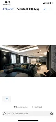 a screenshot of a hotel room with a couch and a table at Velvet in Rambla Cataluña in Barcelona