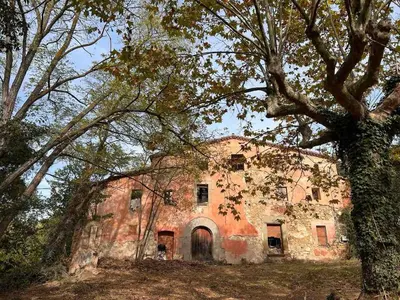 an old brick building in the middle of trees at Hidden garden Central and quiet rest in Barcelona