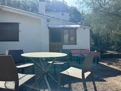 a table and chairs in front of a building at Hidden garden Central and quiet rest in Barcelona