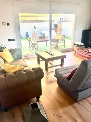 a living room with two couches and a table at Alma Castellana, Casa en plena Naturaleza in Dosríus