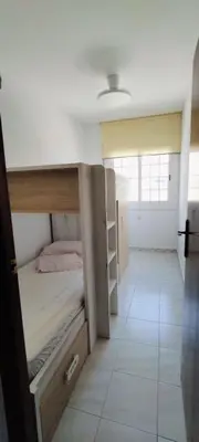 a room with a light on a ceiling with a lamp at Apartamento en la playa in Cunit