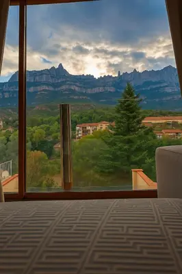 a dining room table with white chairs and a red table cloth at Apartamento en Montserrat- Montserrat Paradise Apartament in Monistrol