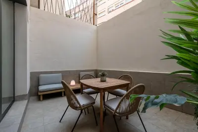 a table and chairs in a room with a table at CATERINA Mar Bella in Barcelona
