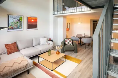 a living room with a couch and a table at CATERINA Mar Bella in Barcelona