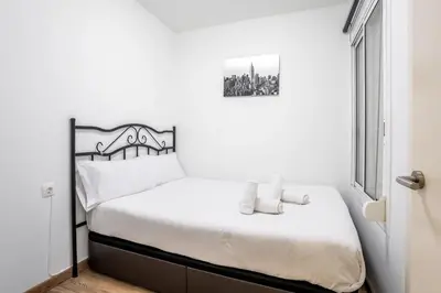 a balcony of a building with a chair on it at The Collection Barcelona - Paseo de Gracia Modern and cozy 3BD - 2BTh in Barcelona