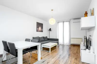 a city street with trees and benches and buildings at The Collection Barcelona - Paseo de Gracia Modern and cozy 3BD - 2BTh in Barcelona
