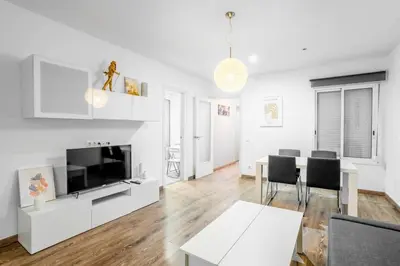 a street in a city with people and trees at The Collection Barcelona - Paseo de Gracia Modern and cozy 3BD - 2BTh in Barcelona