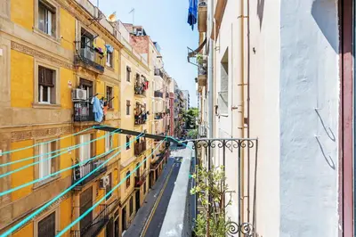an alley between two buildings in a city at Beachside Bliss Charming 1-bedroom, Barceloneta in Barcelona