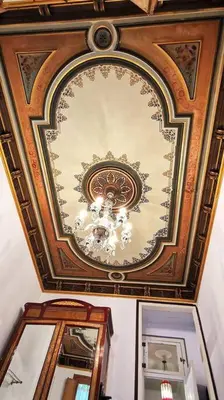 a room with a ceiling with a chandelier and mirrors at Large patio 4 bedrooms 4 bathrooms of which 3 en-suite in Barcelona