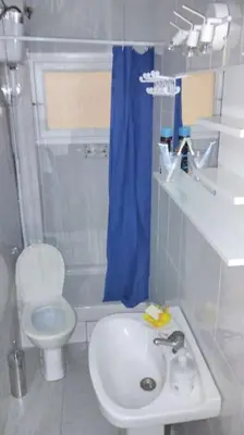 a bathroom with a sink and a toilet and a shower at metro La Salut in Badalona