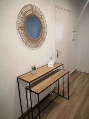 a dressing table with a mirror on a wall at Apartament LA SAL in Pineda de Mar