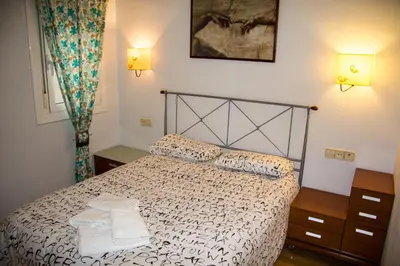 a bedroom with a bed with two towels on it at A Home in Barcelona in Barcelona