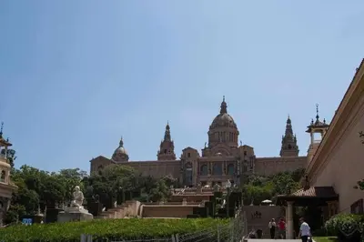 a large building with people walking in front of it at Port VII Apt centrico acogedor w balcon 23 in Barcelona