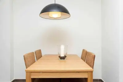 a wooden table with a candle on top of it at Port III Apart céntrico ideal familias 11 in Barcelona