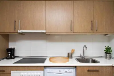 a kitchen with a sink and a counter top at Port VI Apart céntrico ideal familias 22 in Barcelona