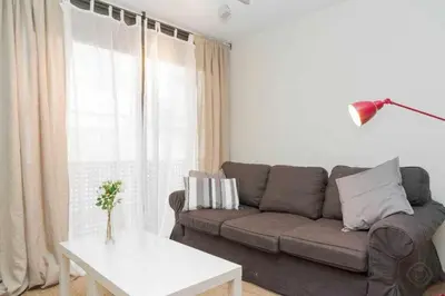 a living room with a couch and a table at Port VI Apart céntrico ideal familias 22 in Barcelona