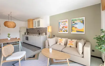 a living room with a couch and a table at CATERINA Sagrera in Barcelona