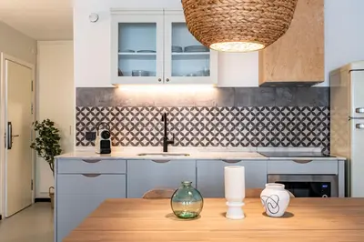 a kitchen with a wooden table and a sink at CATERINA Sagrera in Barcelona
