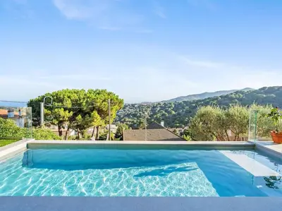 a swimming pool with a view of the mountains at Villa Alella Panoramic Views in Alella
