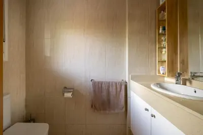 a bathroom with a sink and a toilet at Apartamento Luxury Gran Via 2 in Hospitalet de Llobregat