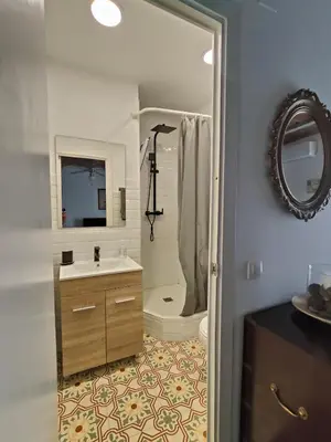 a bathroom with a sink and a shower and a mirror at Magnificent apartment Camp Nou in Hospitalet de Llobregat