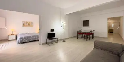 a table and two chairs in a room at Precioso Estudio en Sant Gervasio in Barcelona