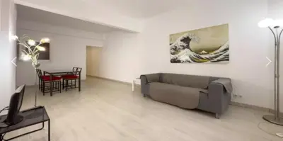 a living room with a table and chairs and a couch at Precioso Estudio en Sant Gervasio in Barcelona
