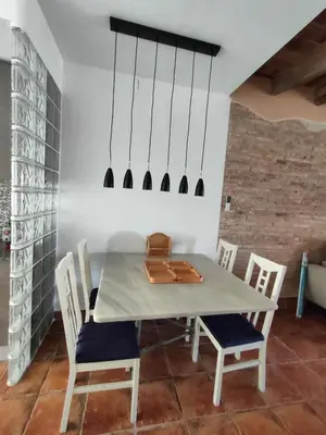 a dining room with a table and chairs at La Bellamar - Apartamento en primera línea mar- in Premiá de Mar