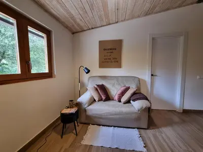 a living room with a couch and a window at Cal Masses , St. Salvador de Guardiola in Guardiola
