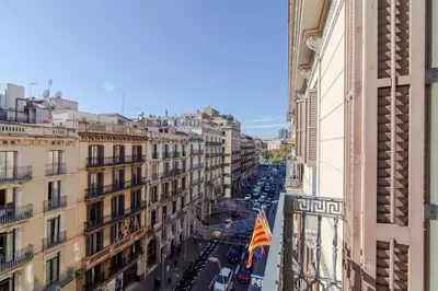 a view of a city street with cars and buildings at Pelayo Deluxe Apartments in Barcelona