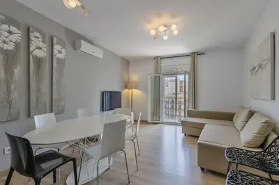 a living room with a table and a couch at Canela Homes BARCELONA BALMES in Barcelona