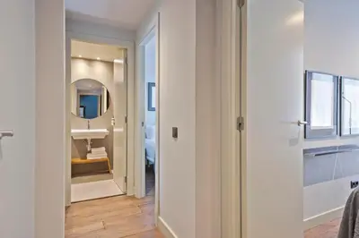 a bathroom with a sink and a mirror at Uma Suites Barceloneta Beach in Barcelona