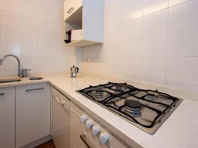 a kitchen with a stove top in a kitchen at Apartment Zodiak by Interhome in Pineda de Mar