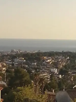 a view of a city with the ocean in the background at CAN TRULLEN CHALET CALAFELL in Calafell