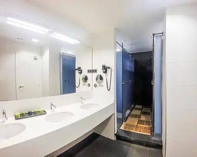 a bathroom with two sinks and a shower at Room018BCN in Barcelona